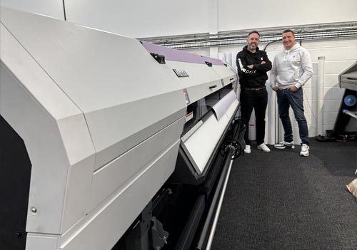 Paul Johnson and Steve Williamson from 2601 with a a Mimaki UJV55-320 UV LED 3.2m roll-to-roll printer from CMYUK.