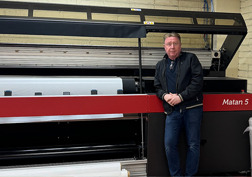 Anthony Byrne from CoverUp with an EFI Matan 5m UV LED roll-to-roll printer from CMYUK