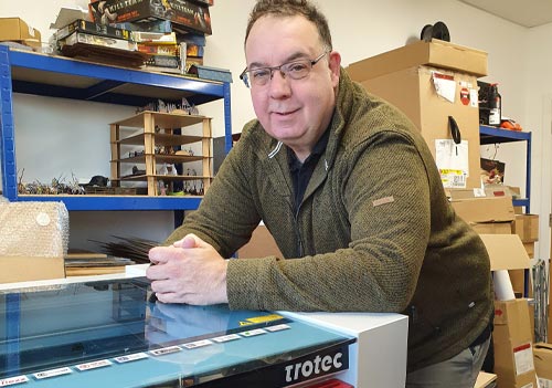 Andrew Fielden from Flatpack Forces with a Trotec Speedy 300 laser cutter and engraver from CMYUK