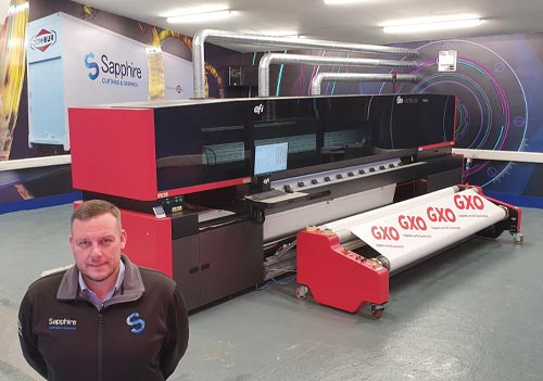 Mark Wayman from Sapphire Curtains & Graphics with the new EFI VUTEk Q3r printer from CMYUK.