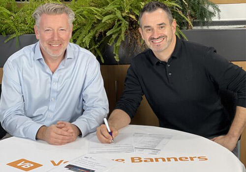Scott Conway and Wayne Bodimeade from Venture Banners signing contract for two h5 EFI VUTEk printers from CMYUK.